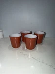 Set 4 Pyrex #19 Coffee Cups Dark Orange Rust. Fixed Price $22.00.