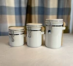 Gibson White Ceramic Canister Set Of 3 W/ Clamp Lids & Wooden Spoons. Fixed Price $47.99.