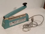 American International AIE-200 Impulse Bag Hand Sealer 260W 120VAC 60HZ Teal. Fixed Price $99.99.