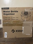 Kssiaz Water Bottle Organizer Round Carbon Steel Wood Black Brown 6 Rings. Fixed Price $15.00.
