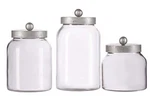 Drew Derose 3 Piece Clear Glass With Silver Lid Design Canister Set. Fixed Price $27.98.