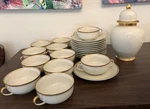 Lot 23 Pc Fitz & Floyd Porcelain Palais Gold Rim Soup Bowls, Saucers, Ginger Jar. Fixed Price $90.00.