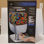The Sharper Image Motion Activated Candy Nut Dispenser Home Office Open Box. Fixed Price $32.00.
